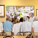 Onlookers scramble to get a look at the freshly updated bulletin board.